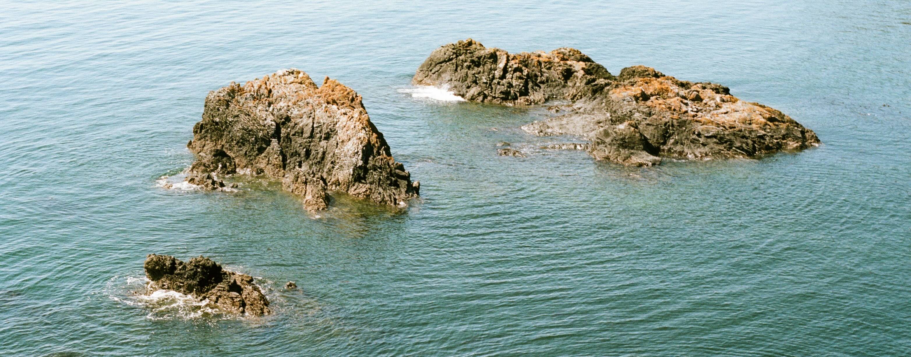 Film photo of submersed rocks at Deception Pass State Park, Anacortes, Washington, USA.
